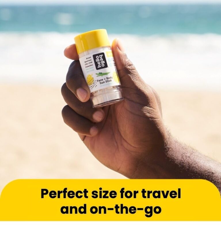 Hello Bello Face + Body Sun Stick held at beach showing compact travel size, perfect for on-the-go as mentioned in Hello Bello sunscreen reviews