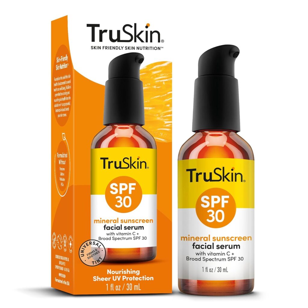 TruSkin Mineral Sunscreen Facial Serum SPF 30 with Vitamin C in amber glass bottle with pump dispenser shown with orange packaging