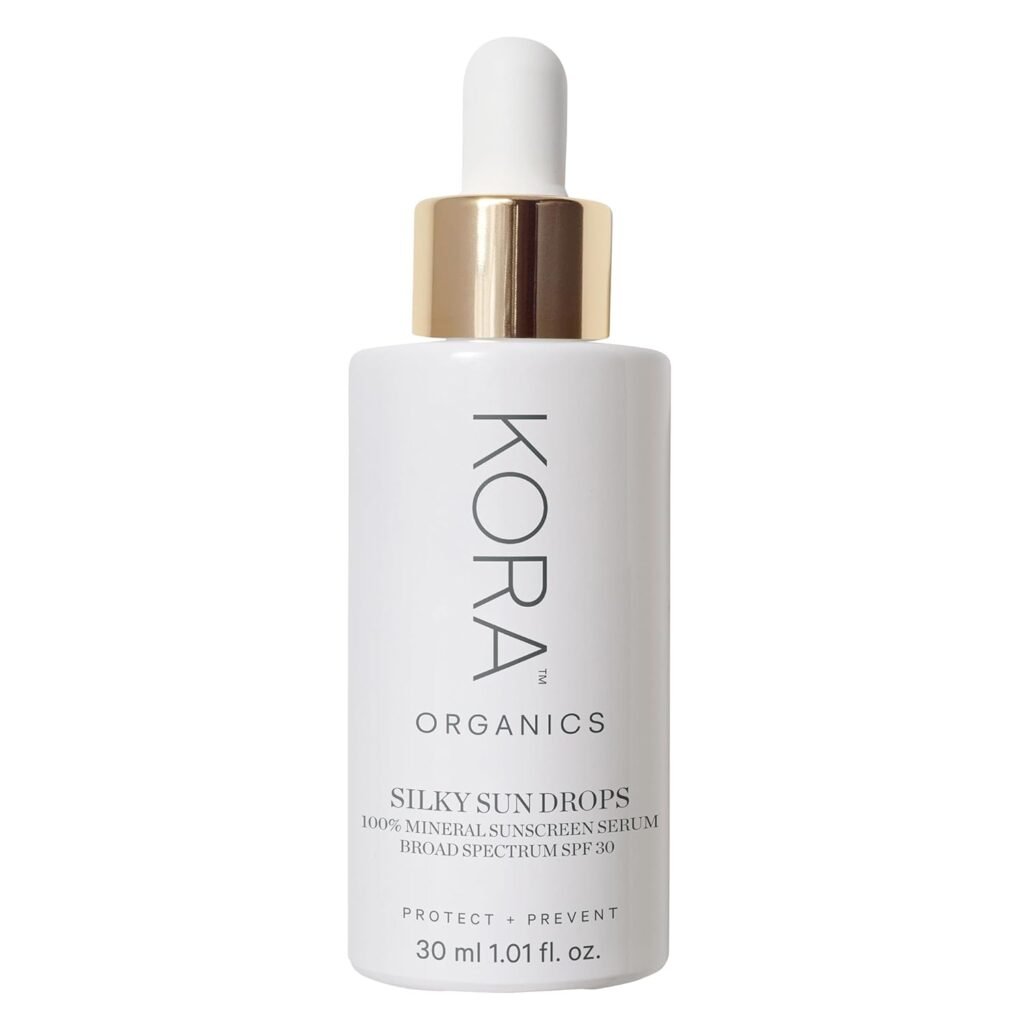 KORA Organics Silky Sun Drops 100% Mineral Sunscreen Serum with SPF 30 in a white glass bottle with gold dropper cap