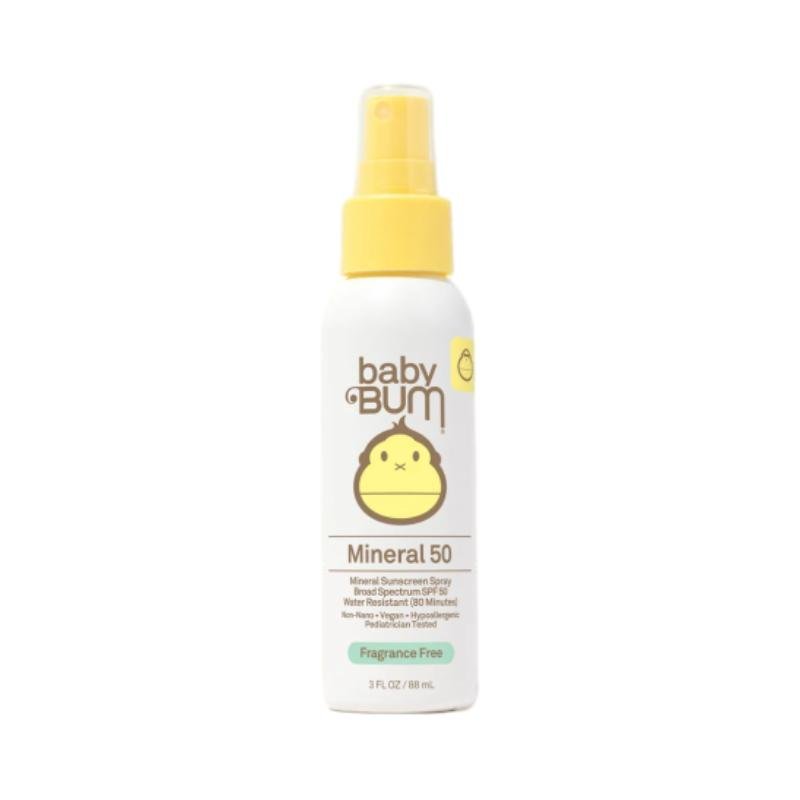Baby Bum Mineral 50 sunscreen spray bottle with white body, yellow pump dispenser, and cute monkey logo, labeled as fragrance-free mineral sunscreen spray for sensitive skin, 3 fl. oz.